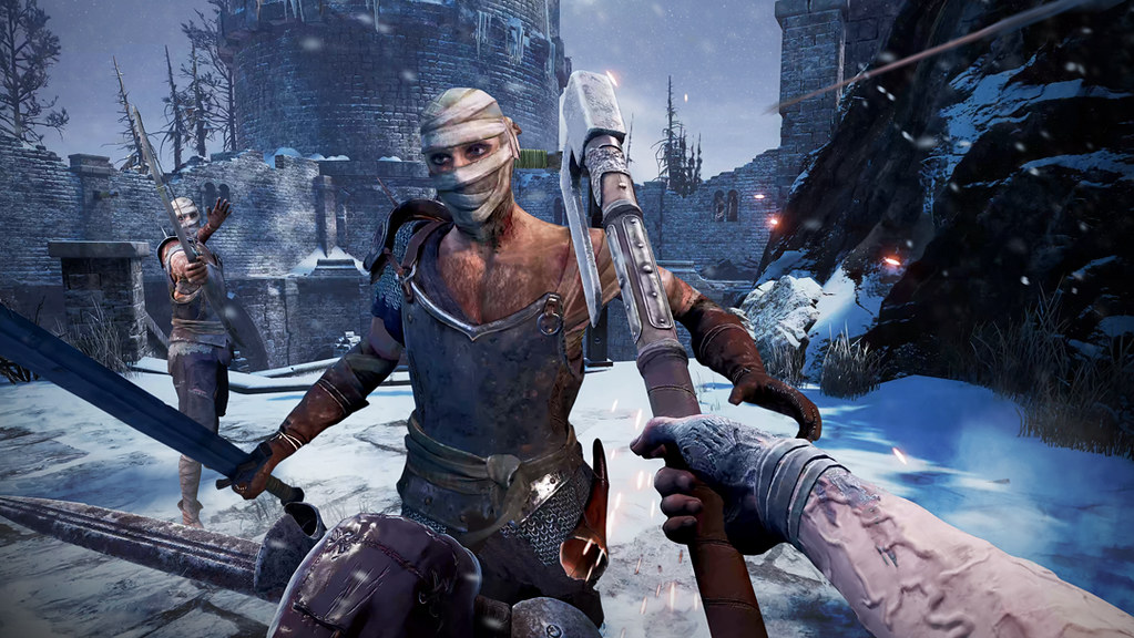 A POV shot. The player swings an axe in one hand towards an attacker directly in front of them, while their other hand clutches a dagger. Behind their opponent another foe has loosened their bow, with the arrow streaking past the player’s head.