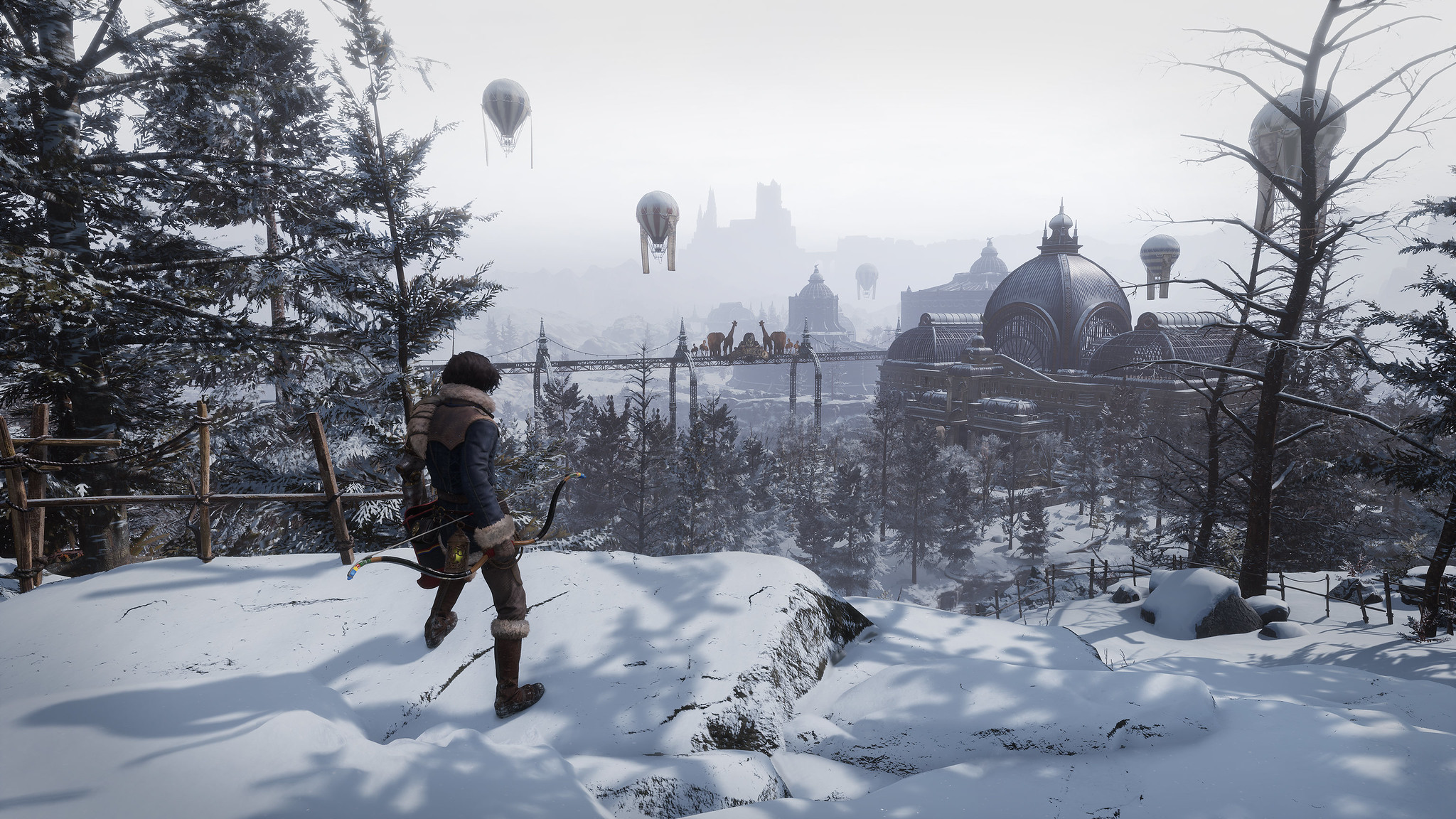 A figure stands on a snowy outcrop overlooking a city. In the skies above float hot air balloons. 